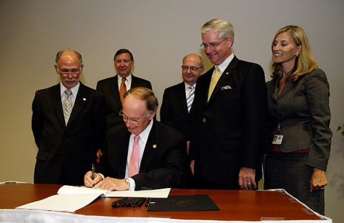 Governor Robert Bentley ceremonially signs Senate Bill 340 during a news conference in Montgomery on Wednesday. Also pictured, from left to right, are Representative Jim McClendon; Mike Horsley, President of the Alabama Hospital Association; Dr. Don Williamson, State Health Officer; Senator Greg Reed and Stephanie Azar, Acting Medicaid Commissioner. Photo credit: Jamie Martin, Governor’s Office.
