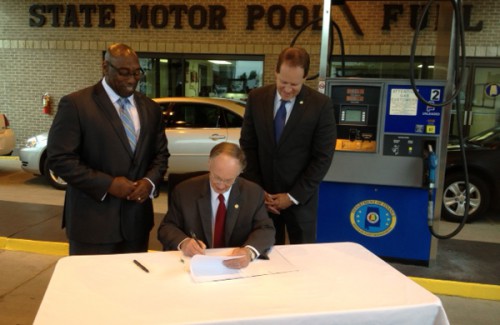Governor Robert Bentley signs Senate Bill 57 at the State Motor Pool facility in Montgomery.  Also pictured behind Governor Bentley are Willie Bradley Jr., ALDOT’s Deputy Director for Fleet Management, and State Senator Cam Ward (R-Alabaster).