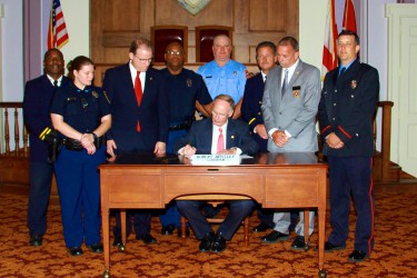 Alabama Governor signs HB 30, sponsored by Rep. Alan Treadaway. Photo by Dionne Whetstone, Alabama House of Representatives.