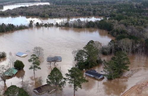 Flooding outside of an improved levee near the downtown area of the flood-prone town of  Elba, Alabama, shown Saturday, Dec. 26, 2015, has been widespread, but the new levee has kept water out of the of downtown. The Pea River is expected to crest at midnight tonight, near 43 feet. The  town was underwater in 1929, which led to the constructions of levees for protection. The city flooded again in 1990 when rising waters overwhelmed levees and again in 1998 when a levee failed under pressure from flood waters. (Governor's Office, Jamie Martin)