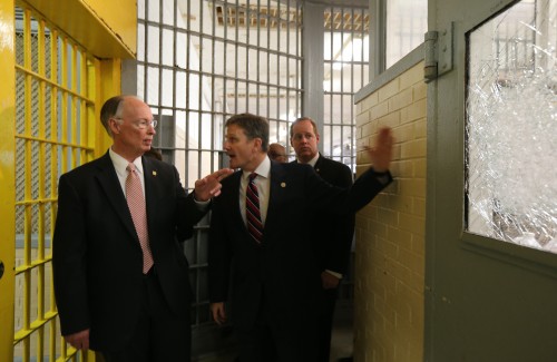 Alabama Gov. Robert Bentley, right, looks at broken glass as he tours a portion of William C. Holman Correctional facility in Atmore, Ala., Tuesday, March 15, 2016 with Alabama Department of Corrections Commissioner Jeff Dun, center, and state Sen. Cam Ward. Two disturbances that have occurred in the last three days at the maximum security prison designed to house 637 inmates. The current population at Holman is 991, which is 156% of design capacity. (Alabama GovernorÕs Office, Jamie Martin)
