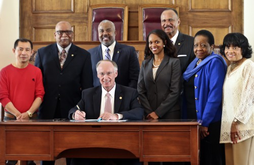 Alabama Gov. Robert Bentley signs an Executive Order creating the Governor's Office of Minority Affairs in the Old House Chamber at the state Capitol in Montgomery, Wednesday, March 9, 2016. The office will be responsible for advising the Governor on issues affecting minorities, including women. The office will focus on the improvement of the overall quality of life of minorities, specifically in the areas of education, health, economics, political participation and empowerment, housing, employment, civil rights, criminal justice and race relations. (Governor's Office, Jamie Martin)