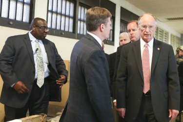 Alabama Gov. Robert Bentley listens to Prison Commissioner Jeff Dunn on a tour of a dormitory at William C. Holman Correctional facility in Atmore, Ala., Tuesday, March 15, 2016. At left is Holman Prison Warden Carter Davenport who was injured in one of the disturbances that have occurred in the last three days at the maximum security prison designed to house 637 inmates. The current population at Holman is 991, which is 156% of design capacity. (Alabama GovernorÕs Office, Jamie Martin)