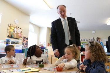 Governor Robert Bentley enjoys a few moments with students at Madison City Schools First Class Pre-Kindergarten Center in Harvest, Ala., Monday, April 4, 2016. Gov. Bentley has proposed an increase in funding of Pre-K by $20 million in the Education Trust Fund to the Legislature. (Governor's Office, Jamie Martin)