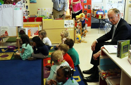 Governor Robert Bentley enjoys a few moments with students at Madison City Schools First Class Pre-Kindergarten Center in Harvest, Ala., Monday, April 4, 2016. Gov. Bentley has proposed an increase in funding of Pre-K by $20 million in the Education Trust Fund to the Legislature. (Governor's Office, Jamie Martin)