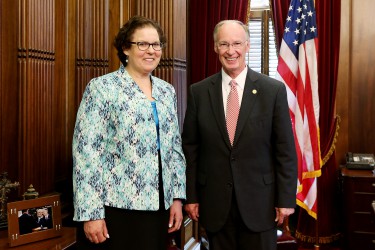 Alabama Gov. Robert Bentley talks with Dana Jacobson, the 2016-2017 Alabama Teacher of the Year, in his office at the state Capitol in Montgomery, Wednesday, May 25, 2016. Jacobson has taught at Clay-Chalkville High School in Jefferson County since 1999. She is known for creating different activities and new avenues for learning to help engage students and teach important values. (Governor's Office, Jamie Martin)