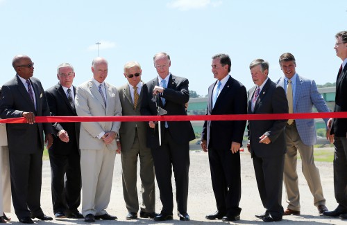 Alabama Gov. Robert Bentley joins other state and local dignitaries at a ribbon cutting for the I-22 Interchange at I-65, Monday, June 20, 2016, in Birmingham. The Alabama Department of Transportation has worked on the final phase of the connector since 1984, building through some of the roughest terrain in the state. It will provide access for rural Marion, Walker and Jefferson counties, and should be a boom to economic development in these areas. (Governor's Office, Jamie Martin)