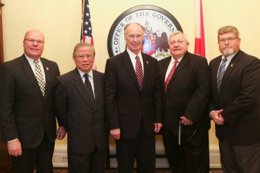 Alabama Governor Robert Bentley poses for a photo with representatives from Golden Dragon Copper and elected officials from Wilcox County as they announce an expansion at Golden Dragon's Wilcox County facility. Wednesday, March 1, 2017. (Governor's Office, Jamie Martin)